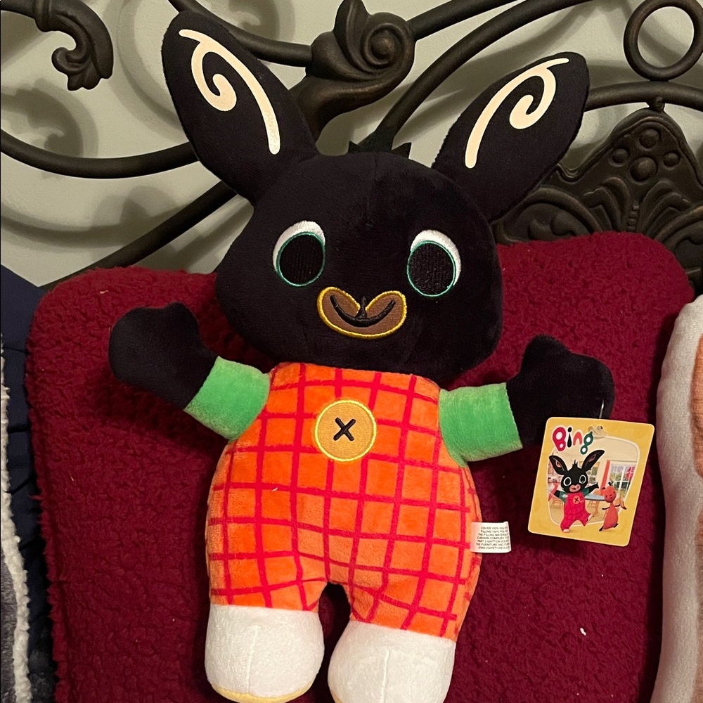 Colorful Plush Bunny Toy - Black, Orange, and Green